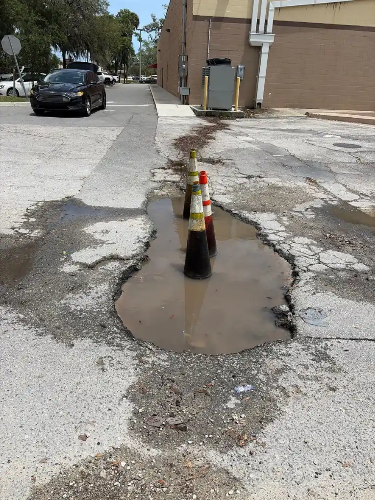 Why Standing Water on Your Orlando Parking Lot Is a Warning Sign