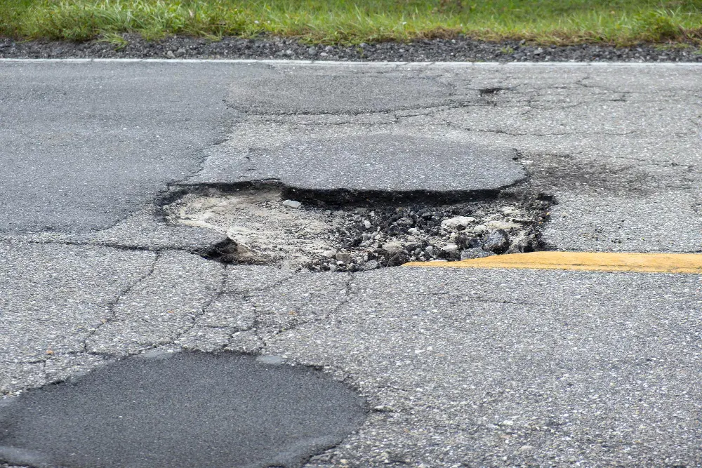 How to Deal with Potholes: A Guide to Keeping Your Asphalt Safe and Smooth