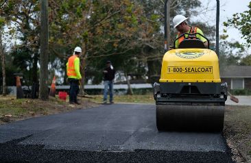 Florida Sealcoating team working on a driveway