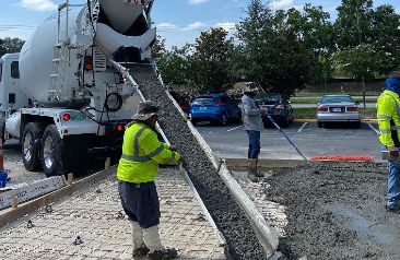 Pouring cement on parking lot